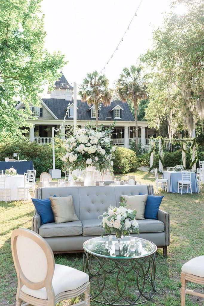 outdoor wedding reception on back lawn of house at Magnolia Plantation