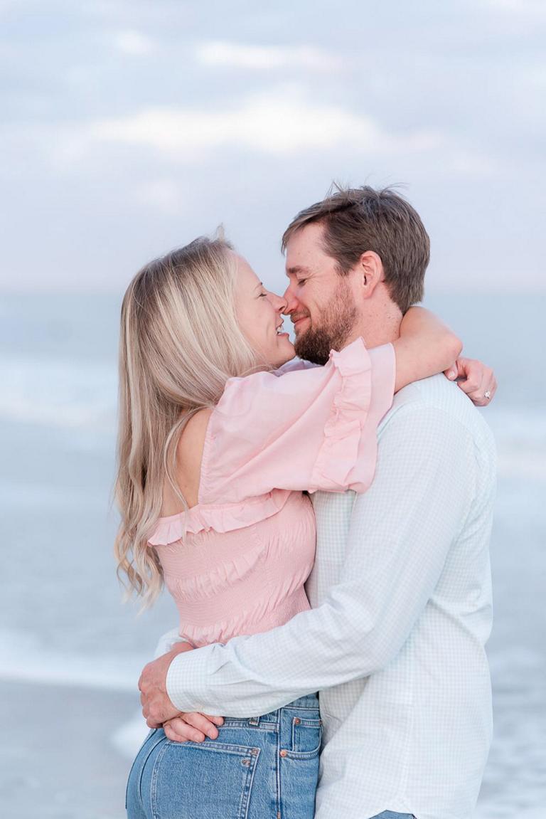 close up of couple laughing about to kiss