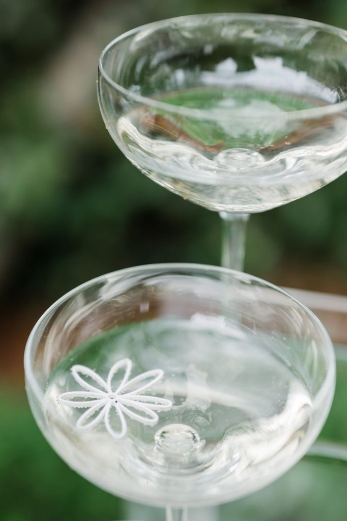 flower decoration floating in champagne flute