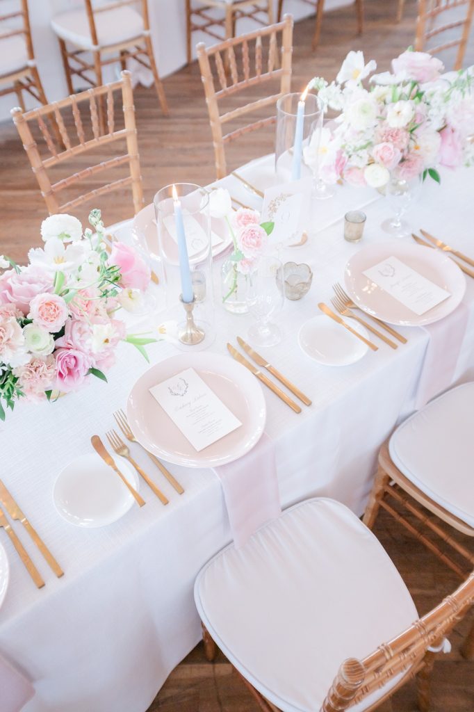 overhead photo of pastel colored wedding reception table setting