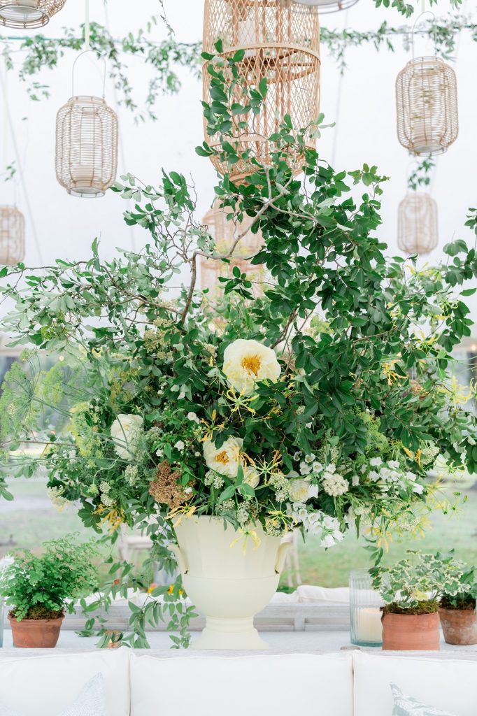 large green and yellow floral arrangement at wedding reception