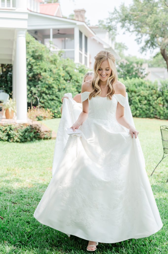bride walking to her first look with groom to be