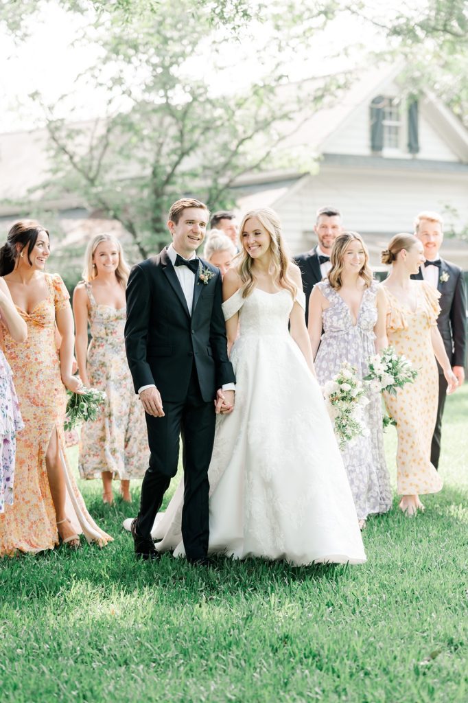 wedding party walking looking at each other