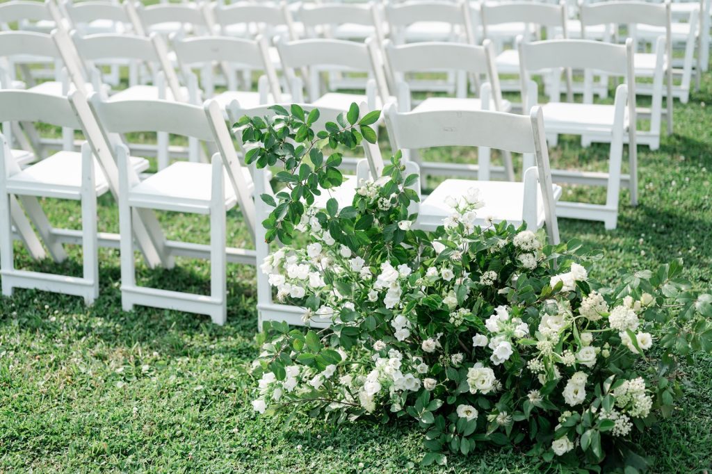 white Florals for aisle of wedding ceremony