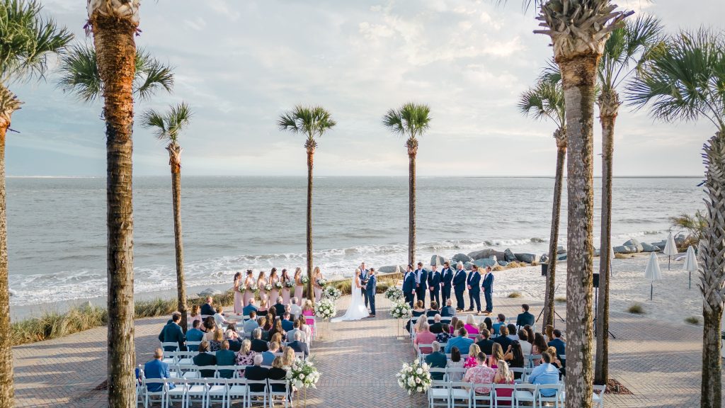 overhead drone photo of beachfront wedding ceremony on a patio