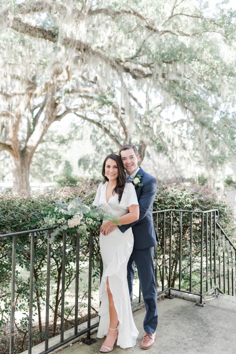 Newly eloped couple pose outside of church