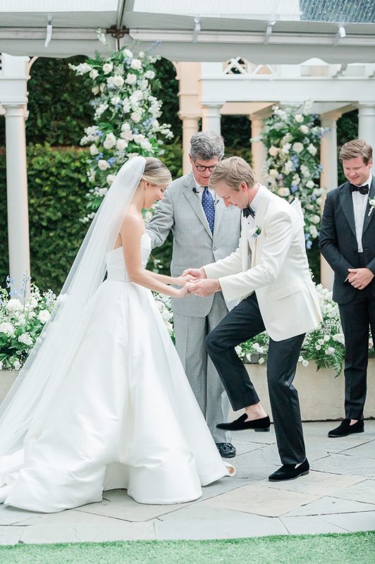 couple stepping on glass in Jewish tradition at wedding ceremony