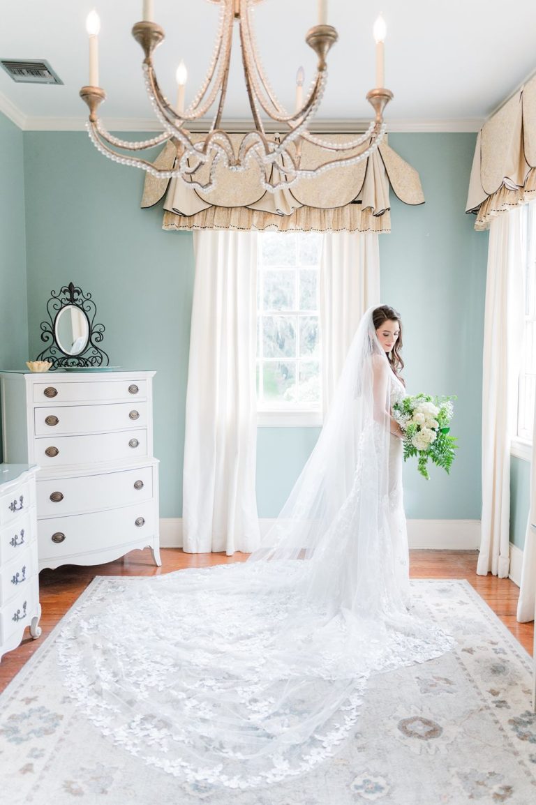 bride standing near window inside Legare Waring House