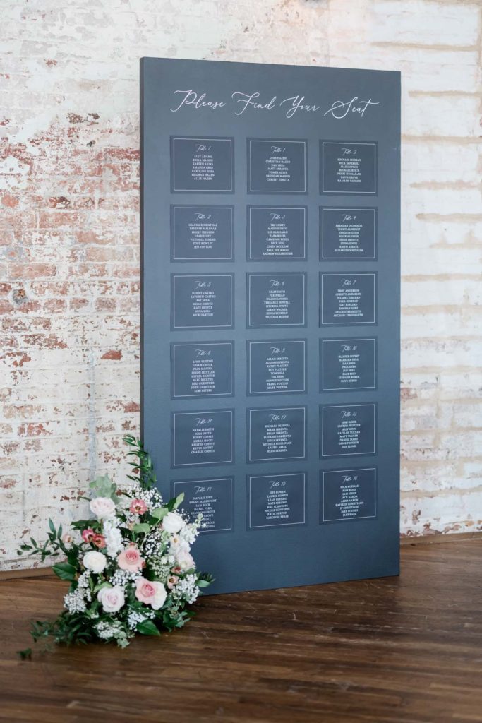 large black seating display chart for wedding reception