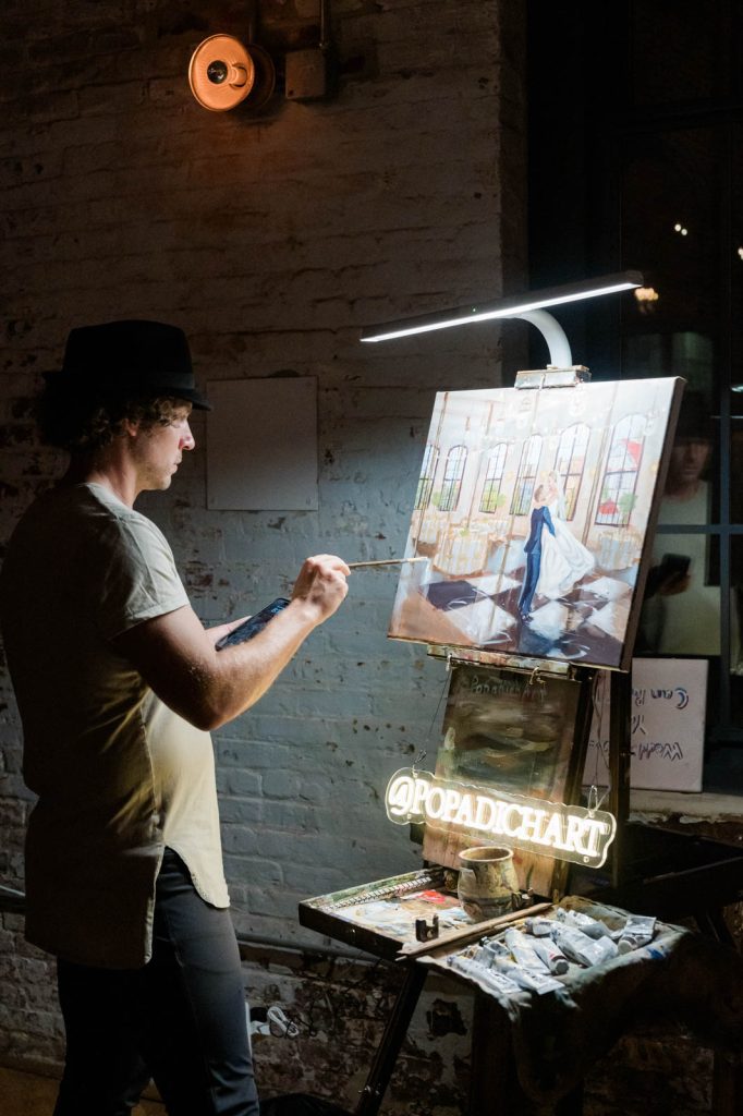 painter painting newlyweds dancing